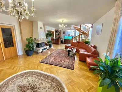 a living room with a couch and a table at Villa with swimming pool near Prague in Kamenice