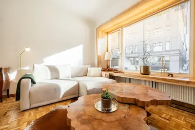 a living room with a couch and a table at Luxury Design Apartment Palackého Residence in Prague