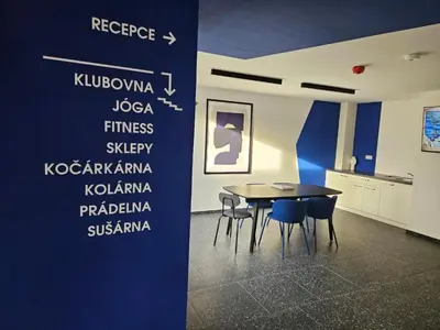 a dining room with a table and chairs on a wall at PRIVATE GARDEN 2BR PRAGUE APARTMENT for Business & Leisure, FREE PARKING & Gym, by LIVE-INN 2 in Prague