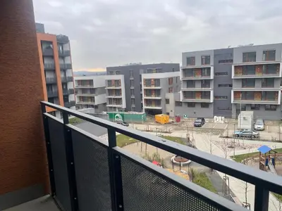 a balcony with a view of a parking lot at Newly built Studio in Prague Near Metro Haje in Prague