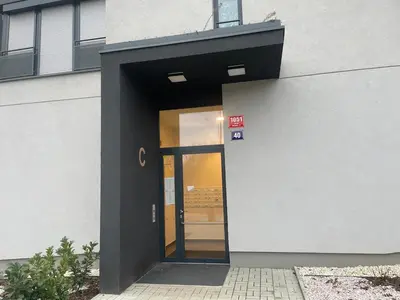an entrance to a building with a glass door at Newly built Studio in Prague Near Metro Haje in Prague