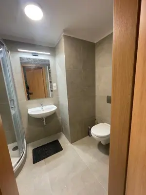 a bathroom with a toilet and a sink at Newly built Studio in Prague Near Metro Haje in Prague