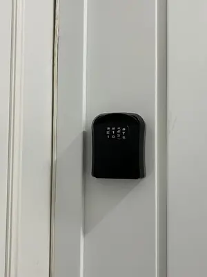a black door knob on a white cabinet at The new brickhouse apartment in Prague