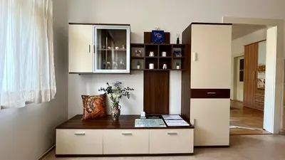a room with a table with a vase on it at Harrison Homes Apartment 03 - Prague City Centre in Prague