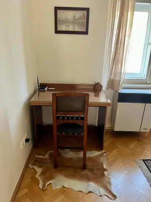 a wooden desk with a chair in a room at Harrison Homes Apartment 03 - Prague City Centre in Prague