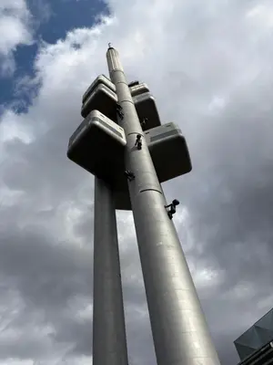 a pair of poles with a traffic light on it at Cosy apt in vibrant area 2 metro stops from Prague's hisorical centre in Prague