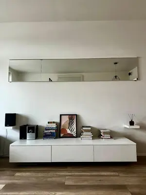 a living room with a white table with books at Terrace apartment near centre, parking, river park in Prague