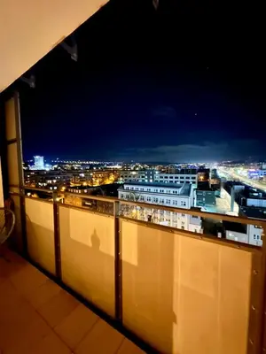 a view of a city at night from a balcony at Terrace apartment near centre, parking, river park in Prague