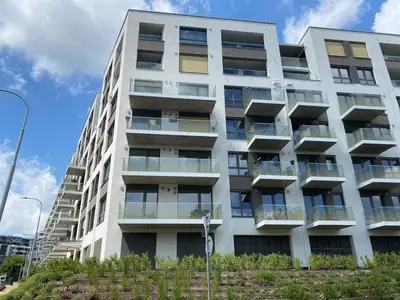 an apartment building with balconies on the side of it at Modern apartment in the Amadeus residence in Prague