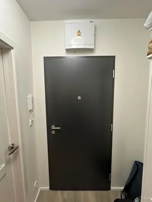 a black door with a sign on top of it at Modern apartment in the Amadeus residence in Prague