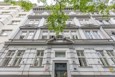 a white building with a door in front of it at Entire unit next to Wenceslas Square in Prague