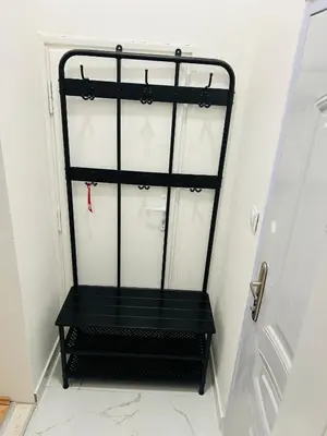 a black chair in a room with a door at Apartment v centrum Praha in Prague