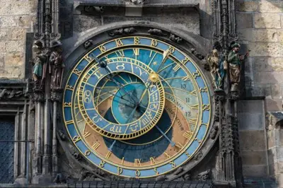 a large clock on the side of a building at Apartment v centrum Praha in Prague