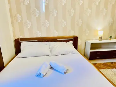 a bedroom with a bed with two towels on it at stunning room in Prague 2 in Prague