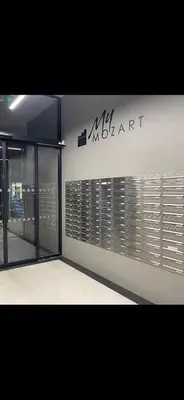 a building with a sign on the side of it at Apartment Mozart in Prague