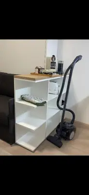 a white desk with a chair next to a couch at Apartment Mozart in Prague