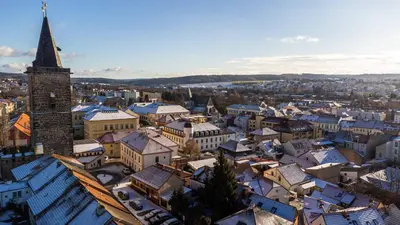 an aerial view of a city with a church tower at Apartmán U Hluboké studny in Rakovník