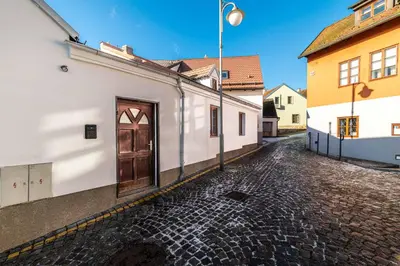 a building with a door on the side of a street at Apartmán U Hluboké studny in Rakovník