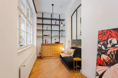 a living room with a couch and a desk at LUXURY Apartman 2 min CHARLES BRIDGE in Prague