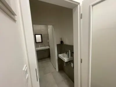 a bathroom with a sink and a mirror at 1Room in Family Apartment Barrandov in Prague