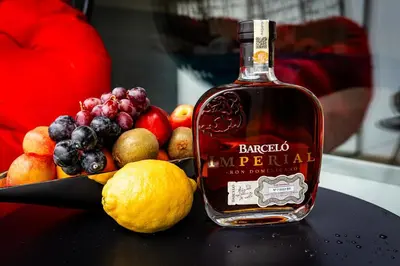 a bottle of bourbon sitting next to a bowl of fruit at Luxury Urban Suite in Prague