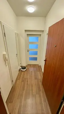 a bedroom with a large white bed and a window at Modern Studio near Letňany Expo in Prague