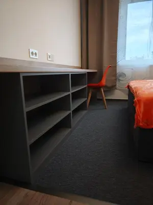 a black blanket sitting on the edge of a bed at Great Apartment Praha in Prague