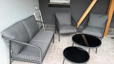 three chairs and a couch and a table at Apartmán na Hejtmánce u letiště v Mladé Boleslavi in Mladá Boleslav
