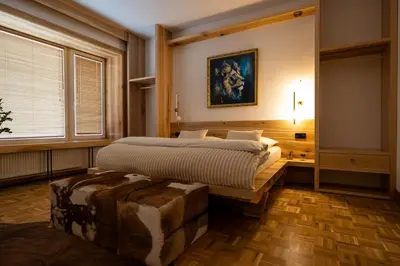 a bedroom with a bed and a large window at Luxury Design Apartment Palackého Residence in Prague