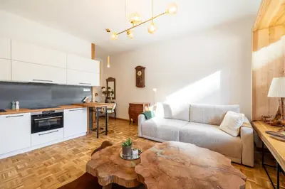 a living room with a couch and a table at Luxury Design Apartment Palackého Residence in Prague