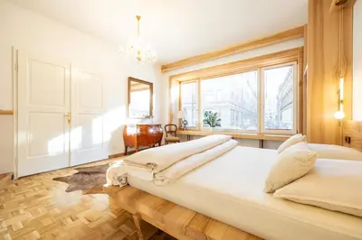 a large bedroom with two beds and a window at Luxury Design Apartment Palackého Residence in Prague