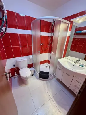 a bathroom with a shower and a toilet and a sink at Hotel CAVOK letiště Příbram in Drásov