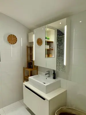 a white bathroom with a sink and a mirror at Duplex Design Flat 3 Bäder Garten 160 m2 in Prague