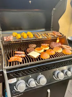 a grill with many different types of food on it at Duplex Design Flat 3 Bäder Garten 160 m2 in Prague