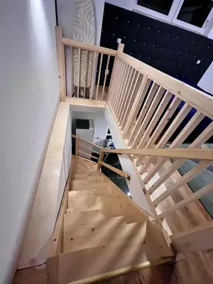 an overhead view of a wooden staircase in a house at ZANIK Cozy Haven in Prague