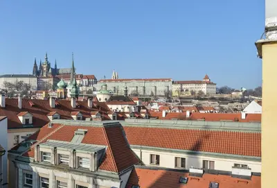 a view of a city with red roofs at Amazing Charles Bridge Apartment in Prague