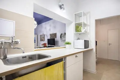 a kitchen with a sink and a counter top at Modern Studio in the Heart of Prague 1 , Steps from Main Station and Old Town in Prague
