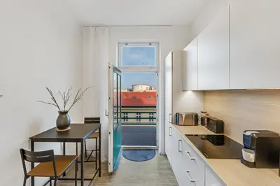 a view of a building with a tower in the background at Skyline 57m Family Suite with Terrace - Prague Center in Prague