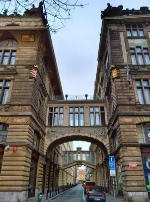 a building with an archway on the side of a street at Prague 1 Apartment Nekázanka in Prague