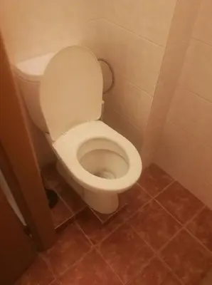 a bathroom with a white toilet in a stall at Bed in shared dormitory near the city centre in Prague