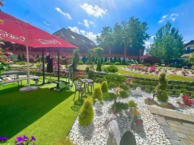 a bedroom with a large bed and a chair at Cozy Sapa Stay - Private Garden House in Prague