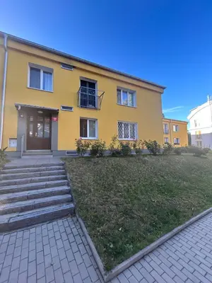 a room with a white table and a chair at Peaceful apartment - centre in 10 min in Prague