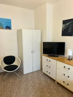 a bath tub in a bathroom with blue tiles at Peaceful apartment - centre in 10 min in Prague