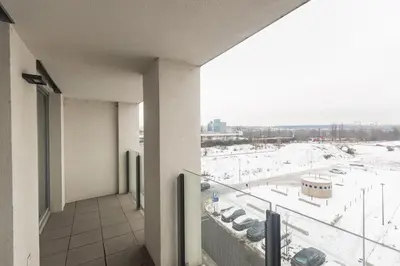 a balcony of a building with a view of a parking lot at Prague apartment with balcony in Prague