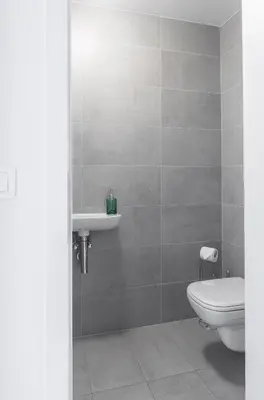 a bathroom with a toilet and a sink at Prague apartment with balcony in Prague