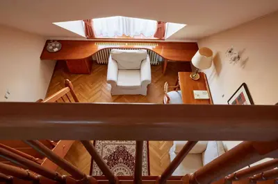 an overhead view of a living room with a staircase at Fleur De Lis Hotel in Prague