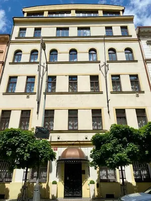 a large white building with a door in front of it at Fleur De Lis Hotel in Prague