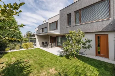 an image of a house with a yard at Prague Airport Luxury Vila in Prague