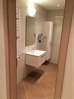 a bathroom with a sink and a mirror at Fortuna Garden I in Prague