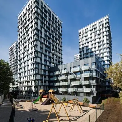 two tall buildings with a playground in front of them at Fortuna Garden I in Prague